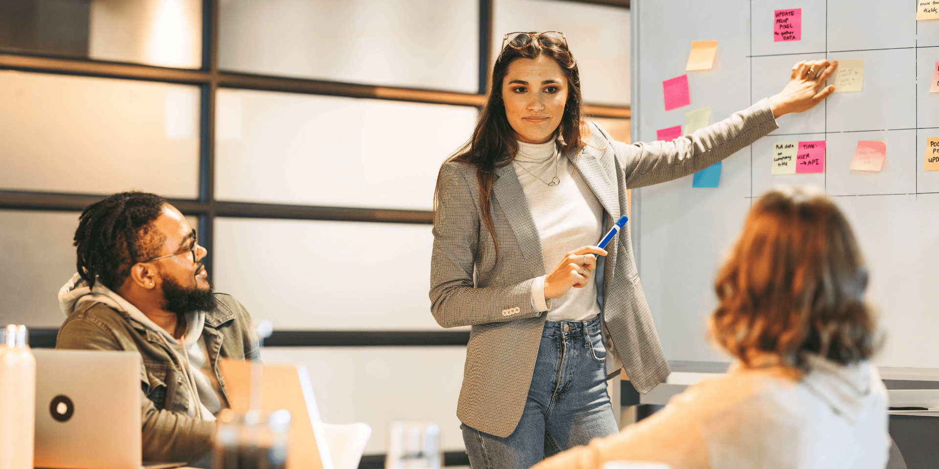 Female project manager working on a tech transformation project, symbolising the rise of women in flexible IT roles in 2025.