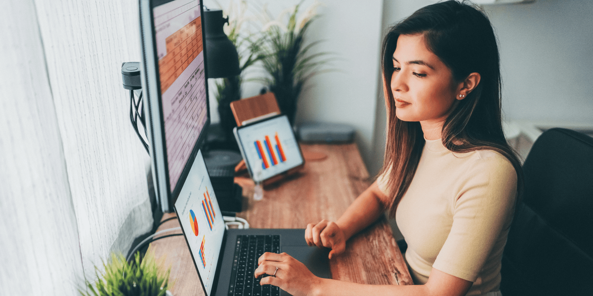A confident woman reviewing job opportunities and analysing data with colleagues in a tech setting.