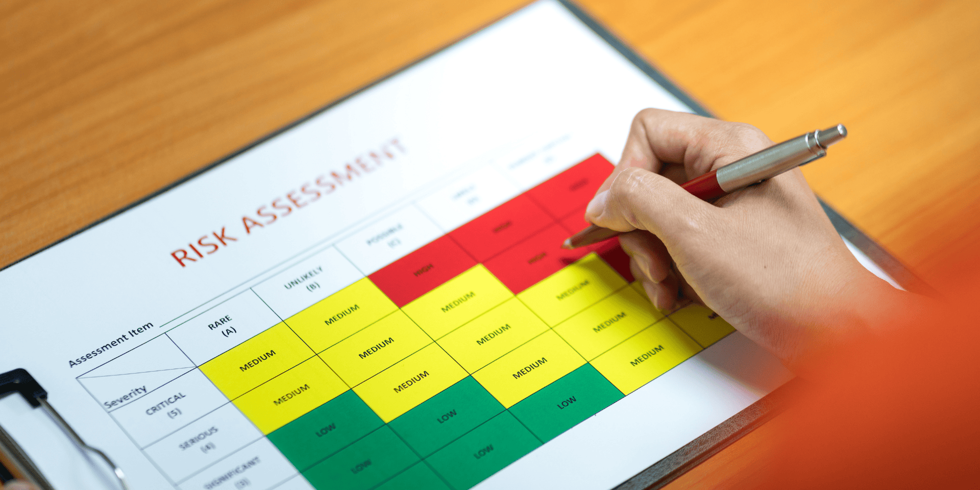 Risk assessment document being reviewed in a negotiation context.