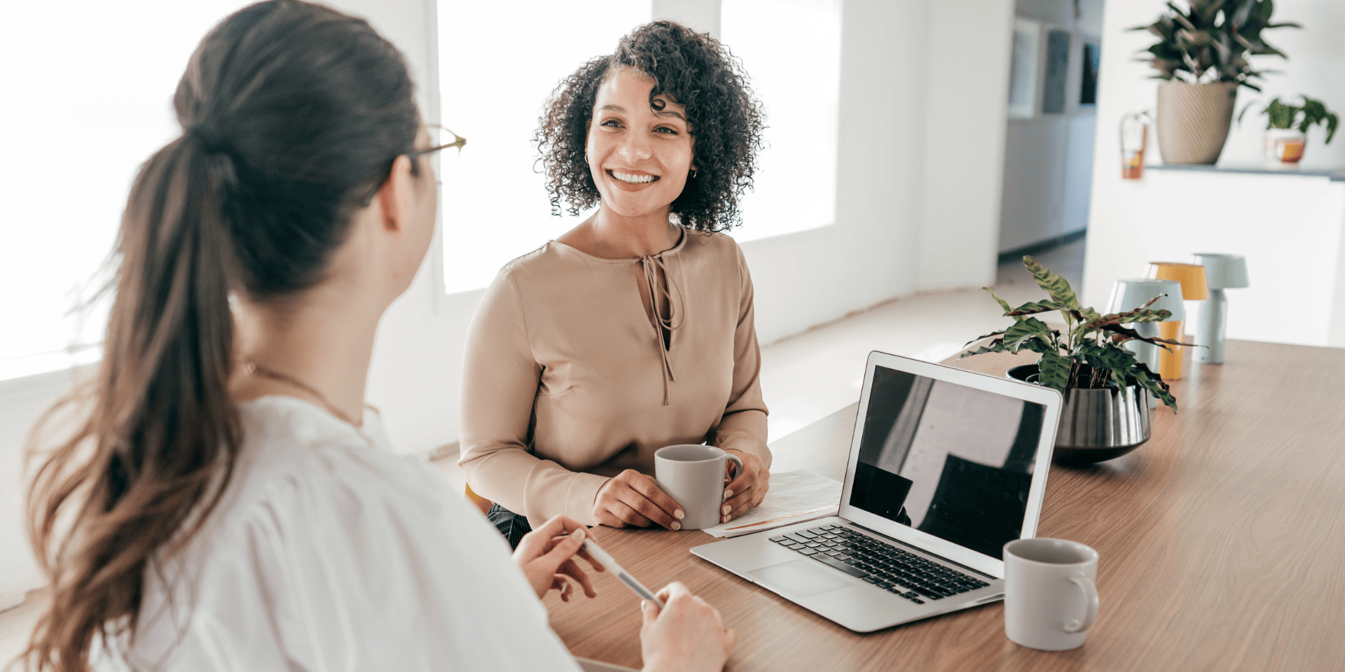 Professional woman in a tech interview asking about diversity and inclusion policies