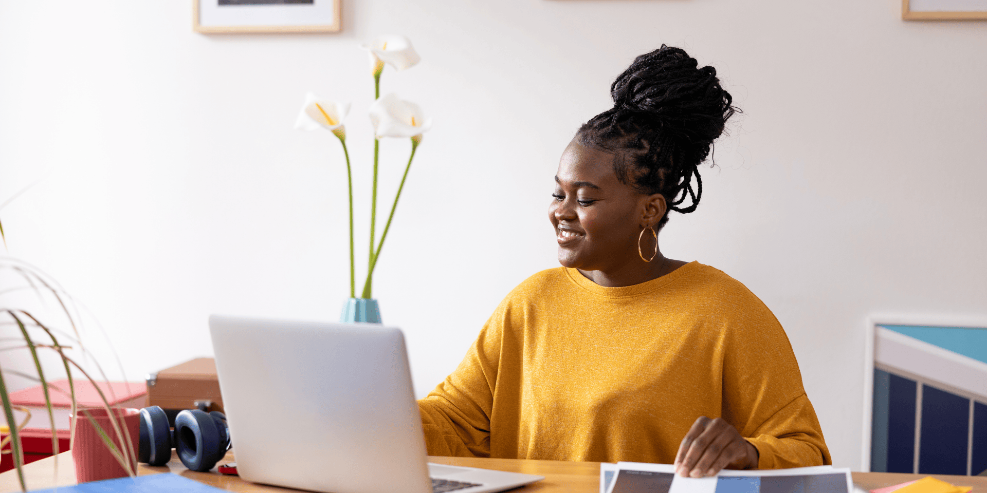 Mid-level woman in tech confidently working from home