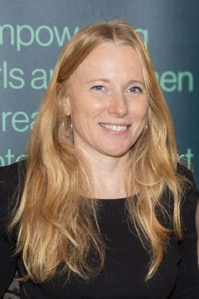 Pip Henderson, Senior Project Manager at RSA, smiling and working in a tech office environment